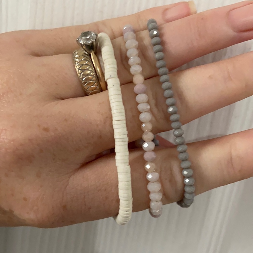 3 RLXCL bracelets. Two crystal one vinyl.